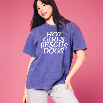 Person wearing a blue t-shirt with 'Hot Girls Rescue Dogs' text on a pink background