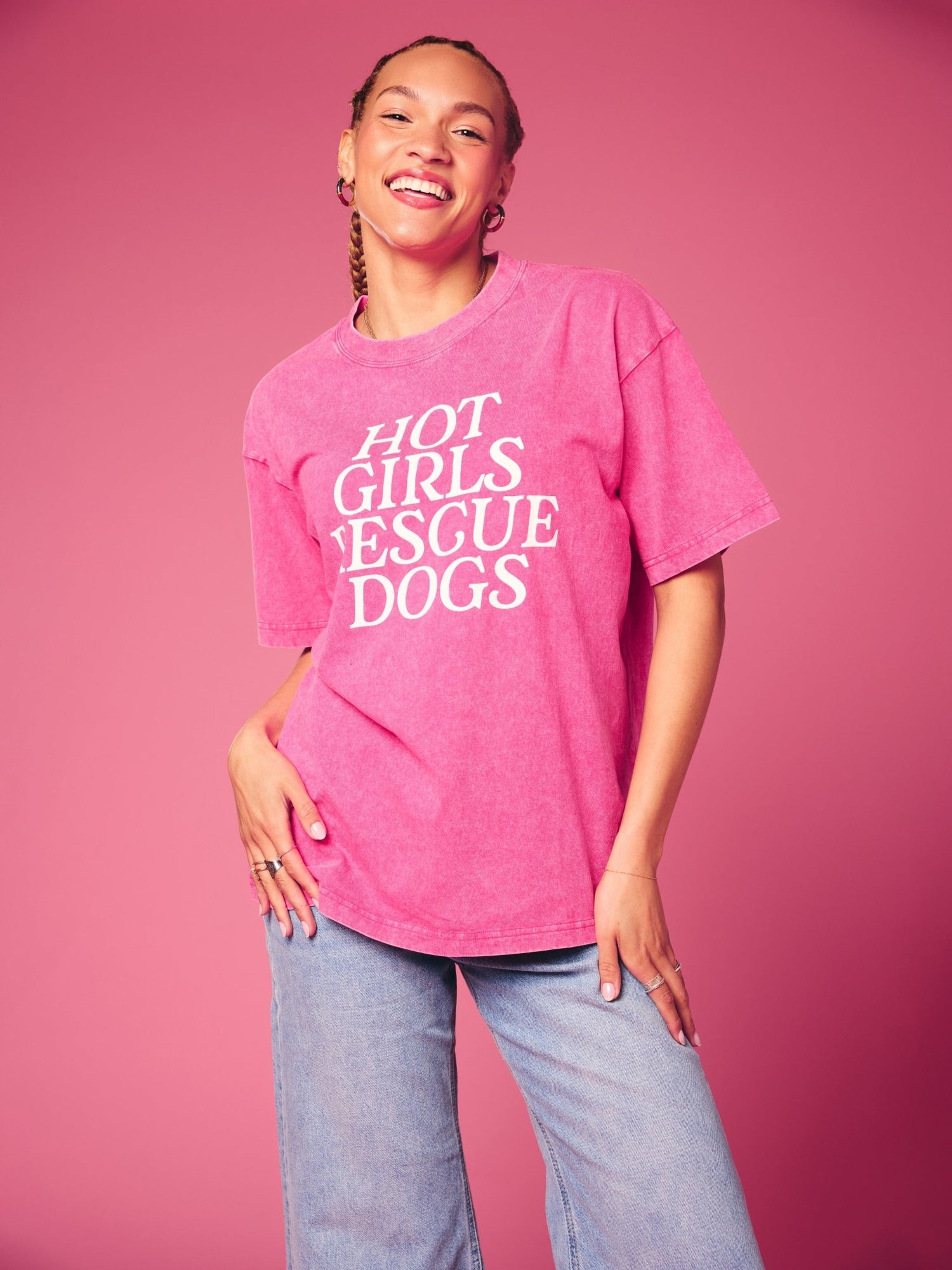 Person wearing a pink t-shirt with 'Hot Girls Rescue Dogs' text on a pink background