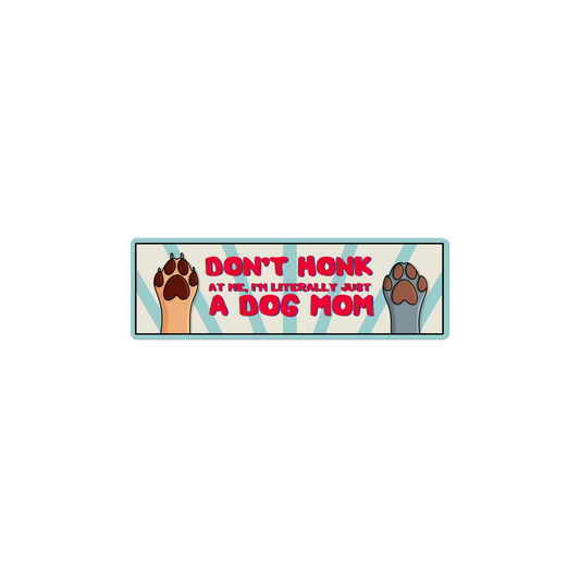 Bumper sticker with dog paws and text 'Don't honk at me, I'm literally just a dog mom' on a white background