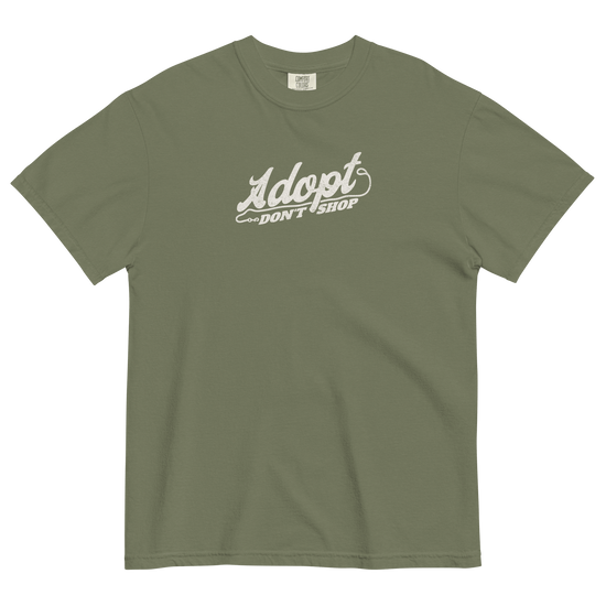 Green t-shirt with 'Adopt Don't Shop' text on a black background