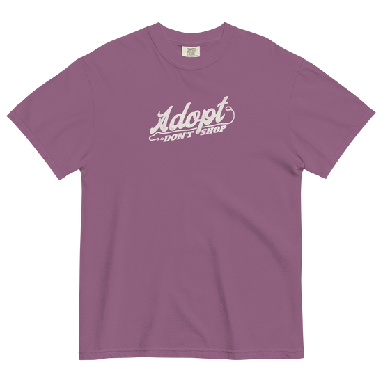 Purple t-shirt with 'Adopt Don't Shop' text on a black background