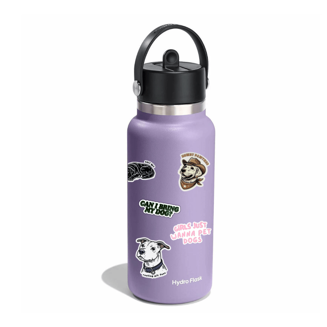 Purple water bottle with stickers on a white background